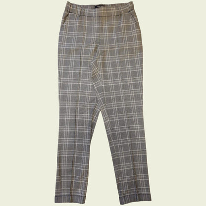 Plaid pants on a beige background