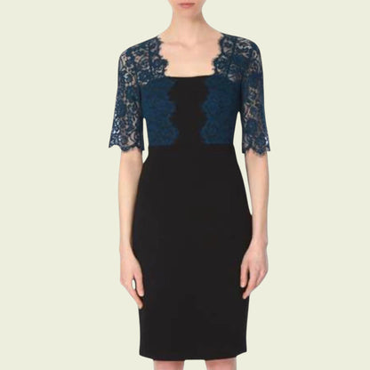 Model wearing black dress with teal lace bolero on beige background