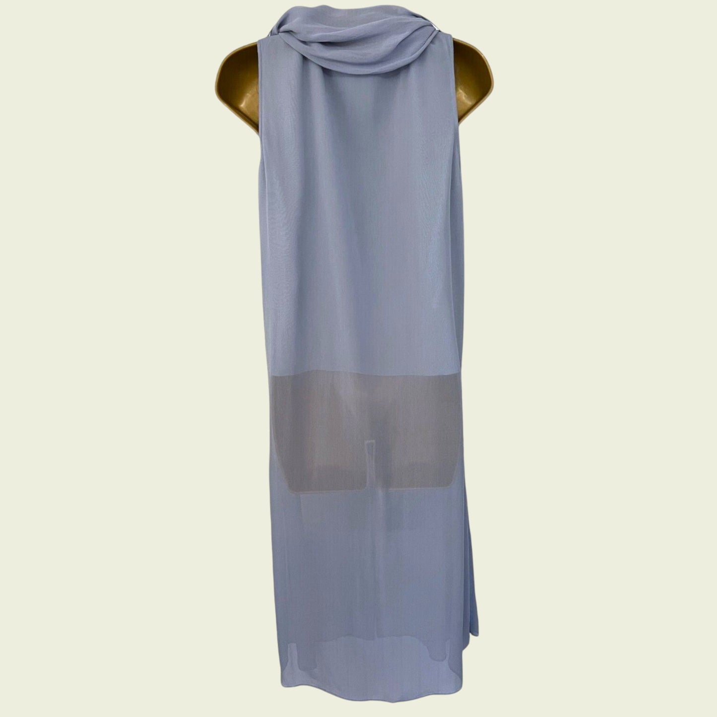 Light blue sleeveless dress with a gray panel on a mannequin against a beige background