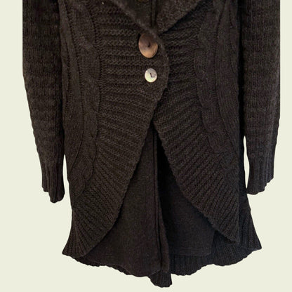 Dark brown knitted cardigan with buttons on a beige background