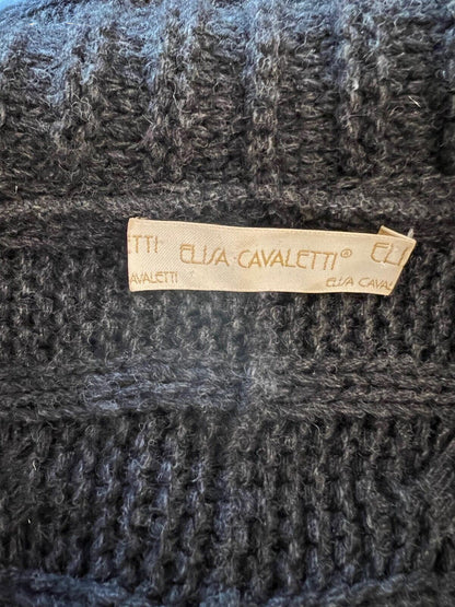 Close-up of a textured fabric with a brand label on a dark background