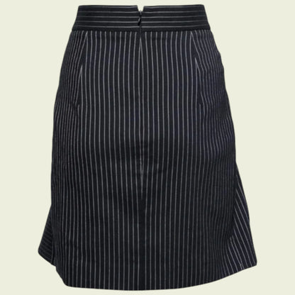 Black pinstripe skirt on a beige background