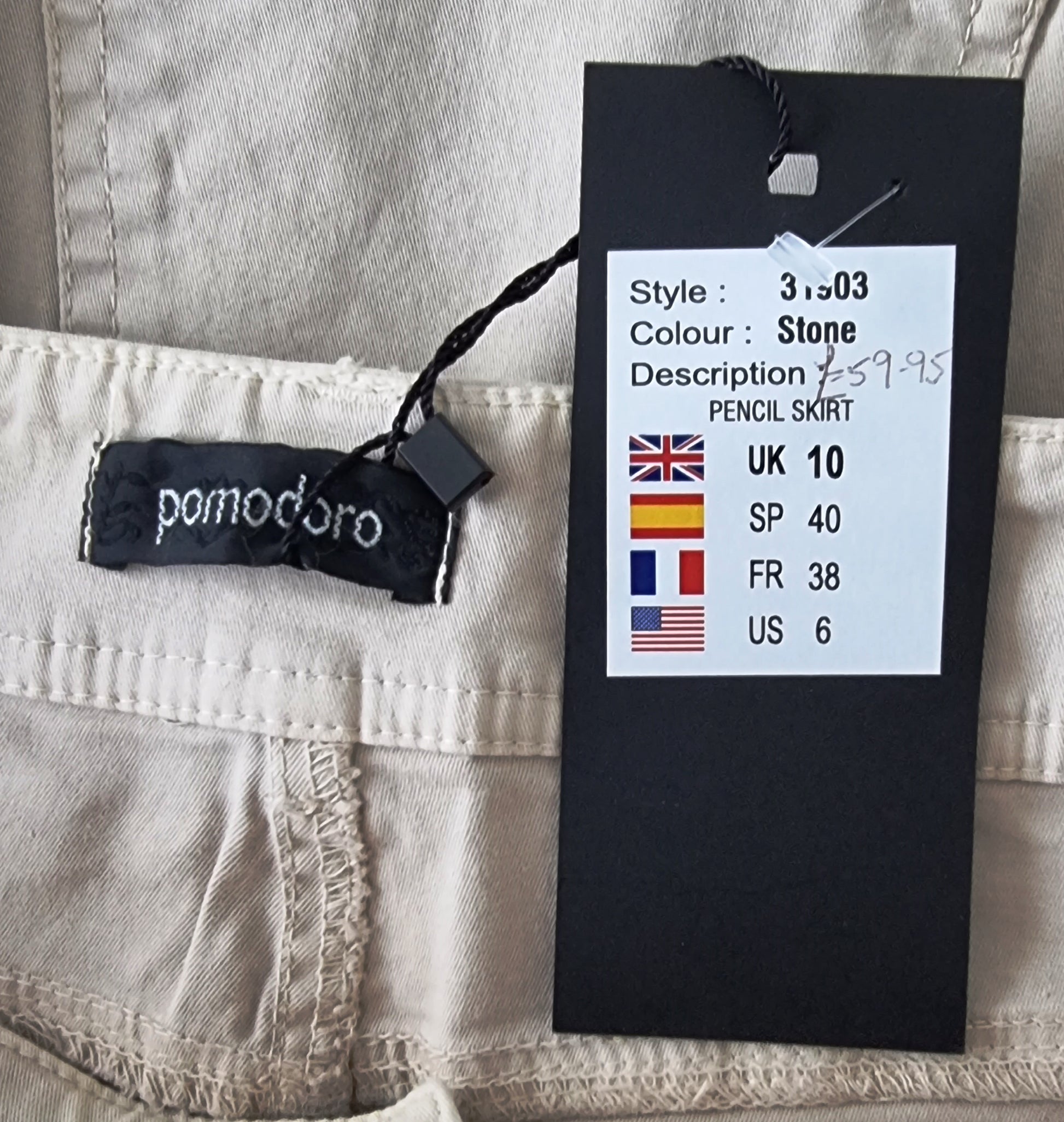 Pomodoro brand label on a pencil skirt with size and color information.
