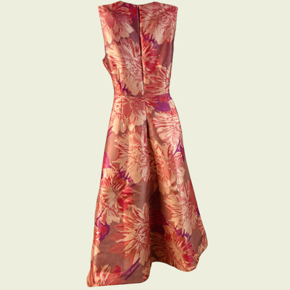 Floral dress with a pattern of pink and orange flowers on a beige background