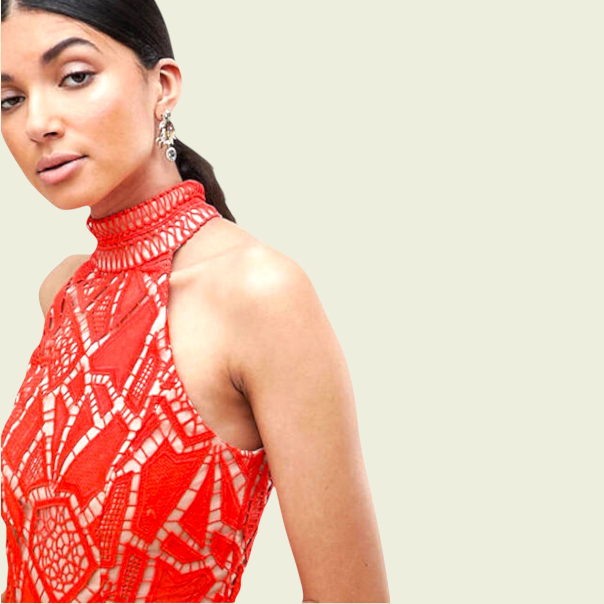Woman wearing a red patterned top against a plain background