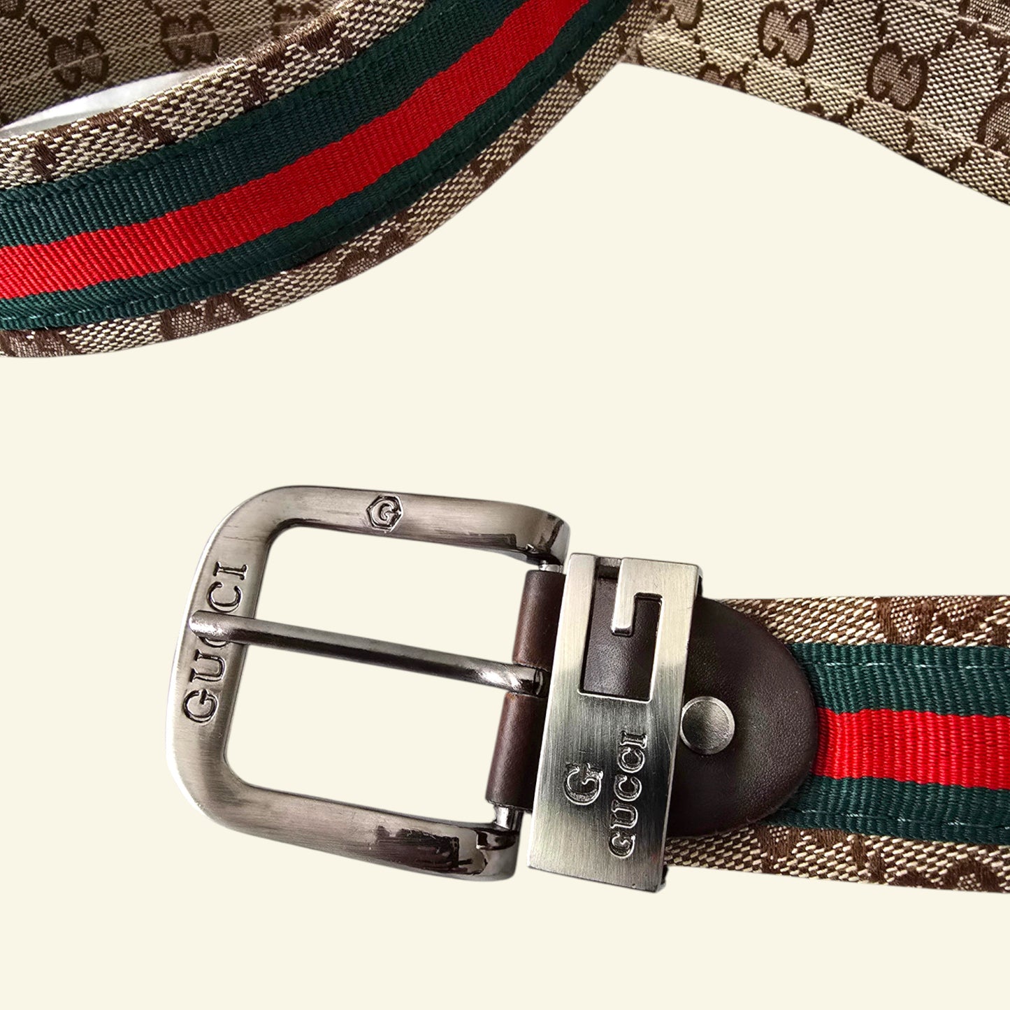 Gucci belt with signature pattern and red, green, and blue striped webbing on a white background