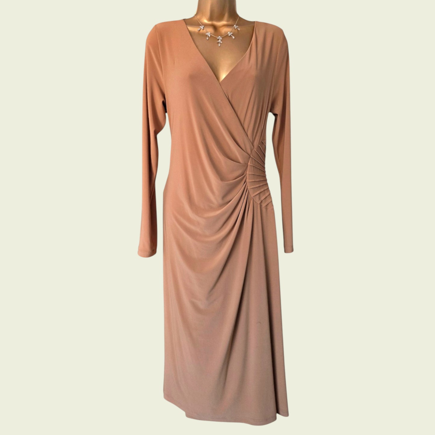 Brown dress on a mannequin against a beige background