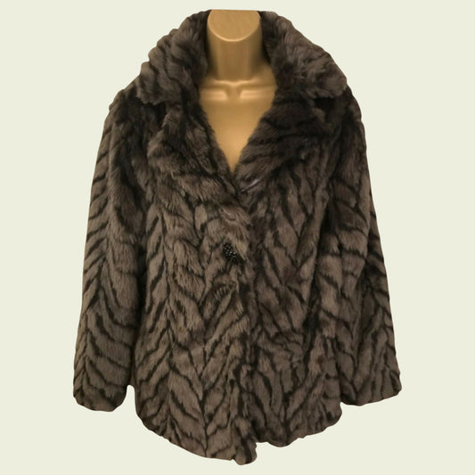 Brown fur coat on a mannequin against a beige background