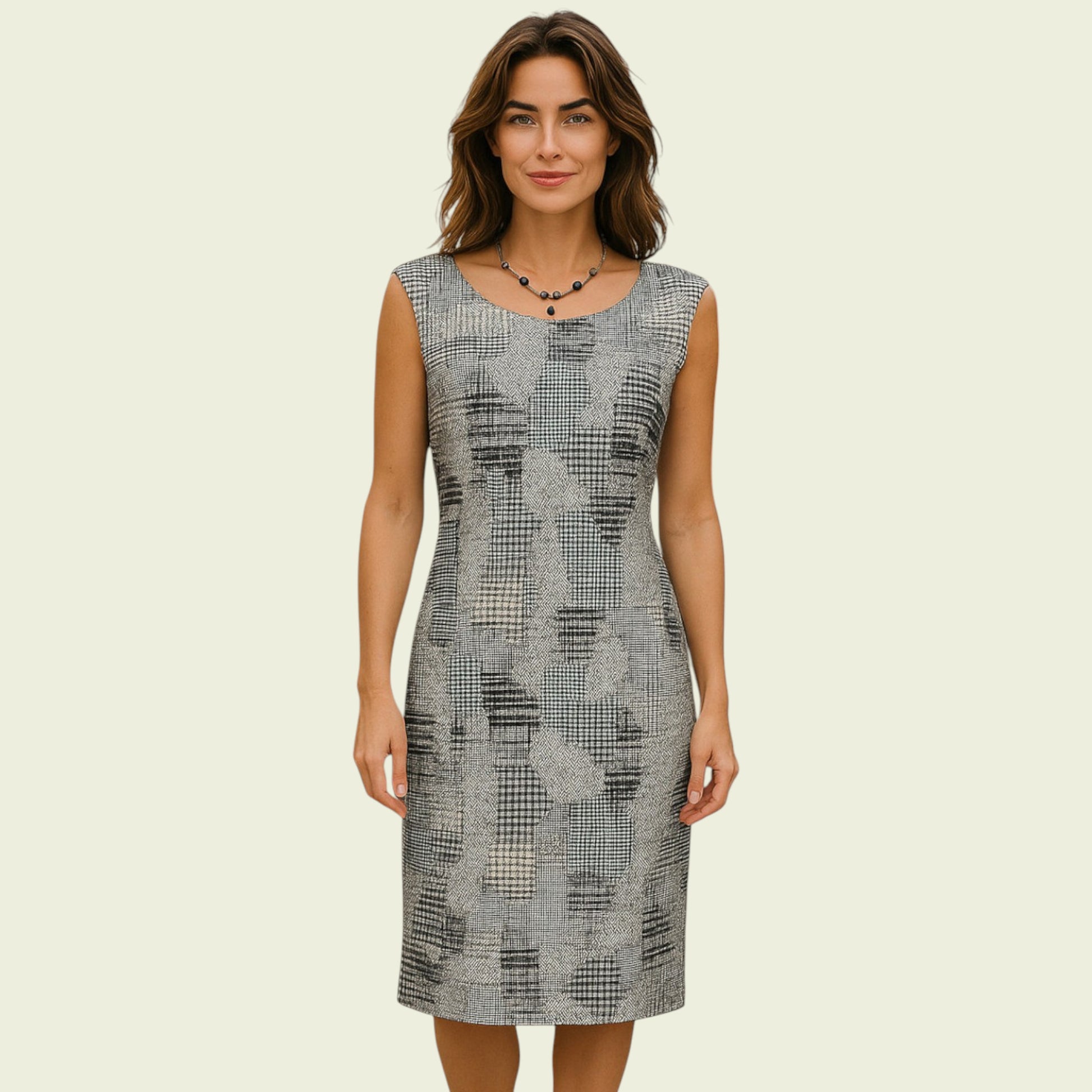 Woman wearing a patterned dress on a beige background