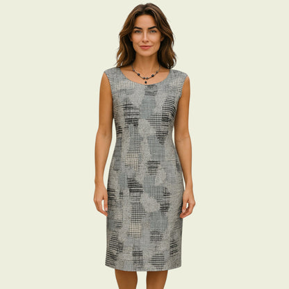 Woman wearing a patterned dress on a beige background