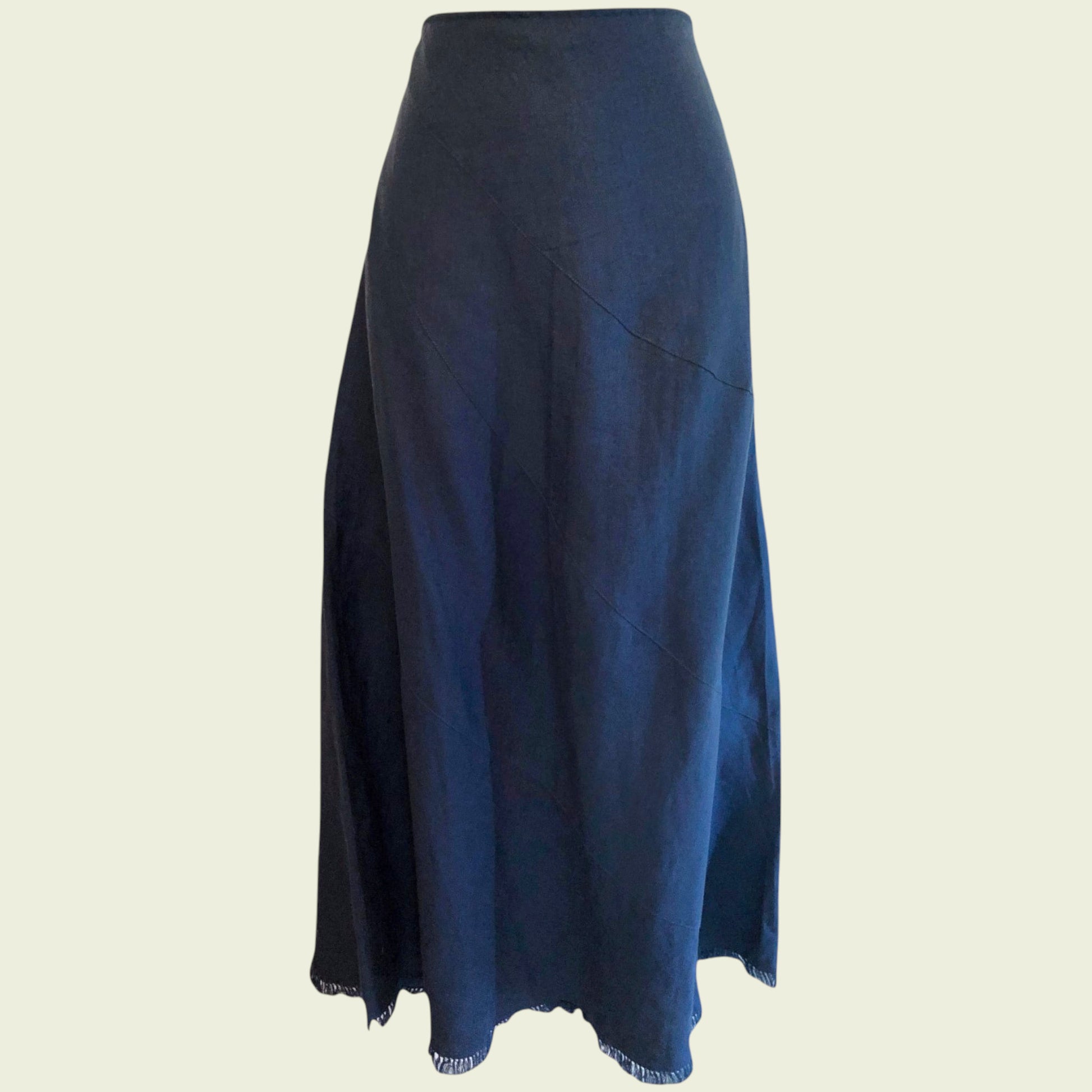 Teal skirt on a mannequin against a beige background