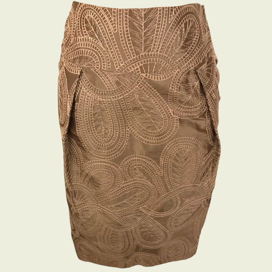 Brown patterned skirt on a beige background