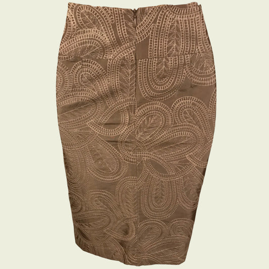 Brown patterned skirt on a beige background