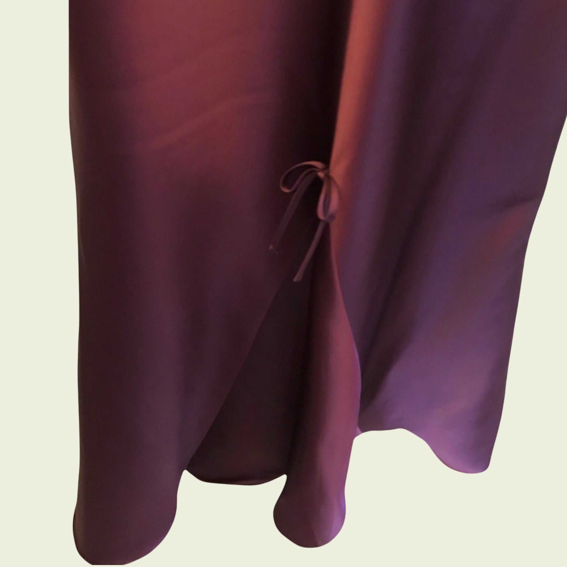 Close-up of a purple fabric with a beige background
