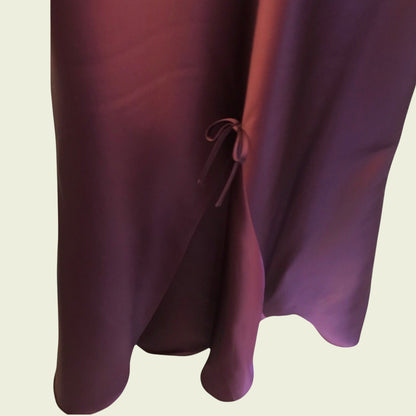 Close-up of a purple fabric with a beige background