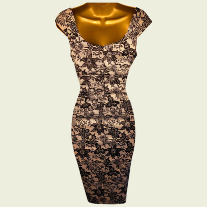 Black lace dress on a mannequin against a beige background