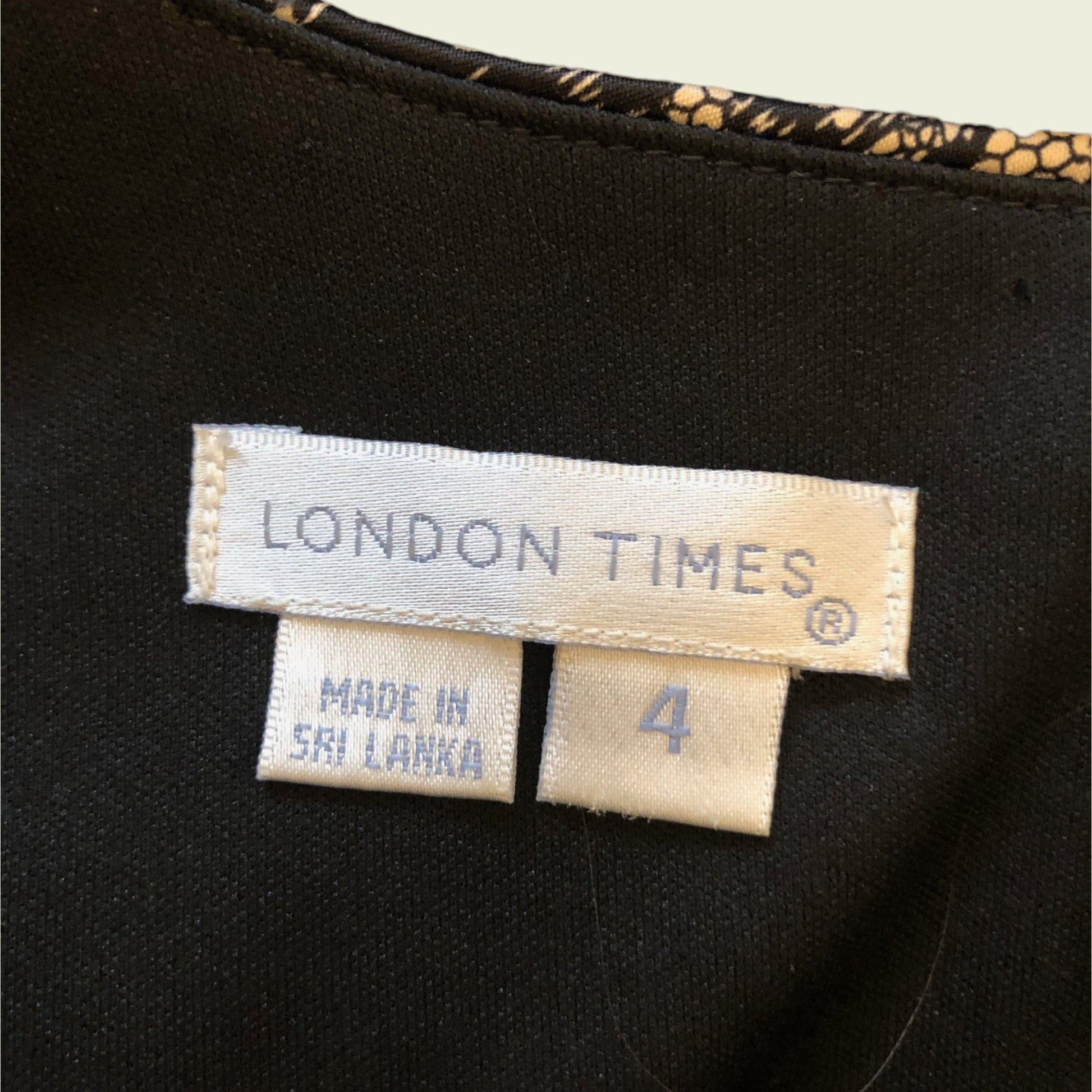 Clothing label with London Times on black background