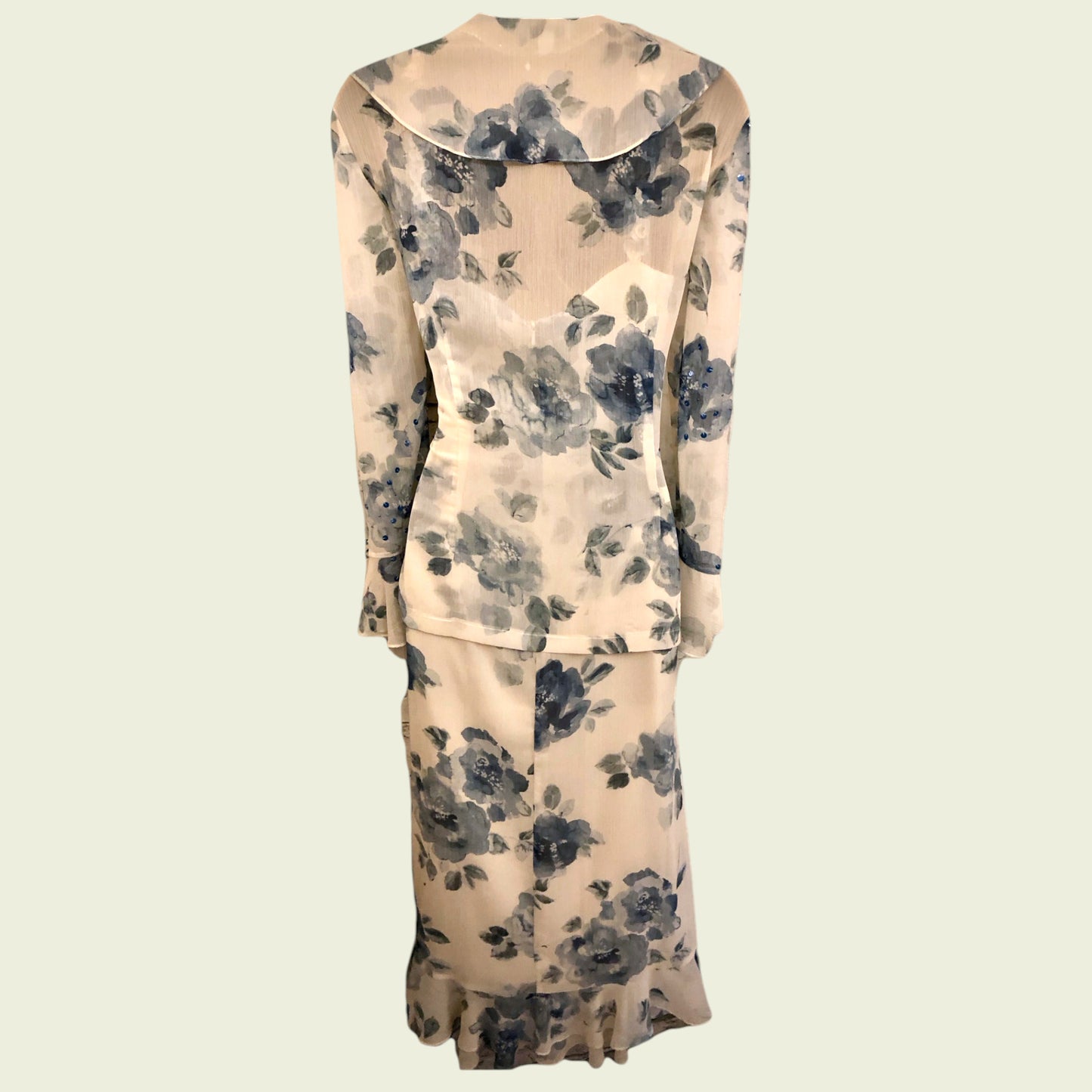 Floral-patterned two-piece suit on a beige background