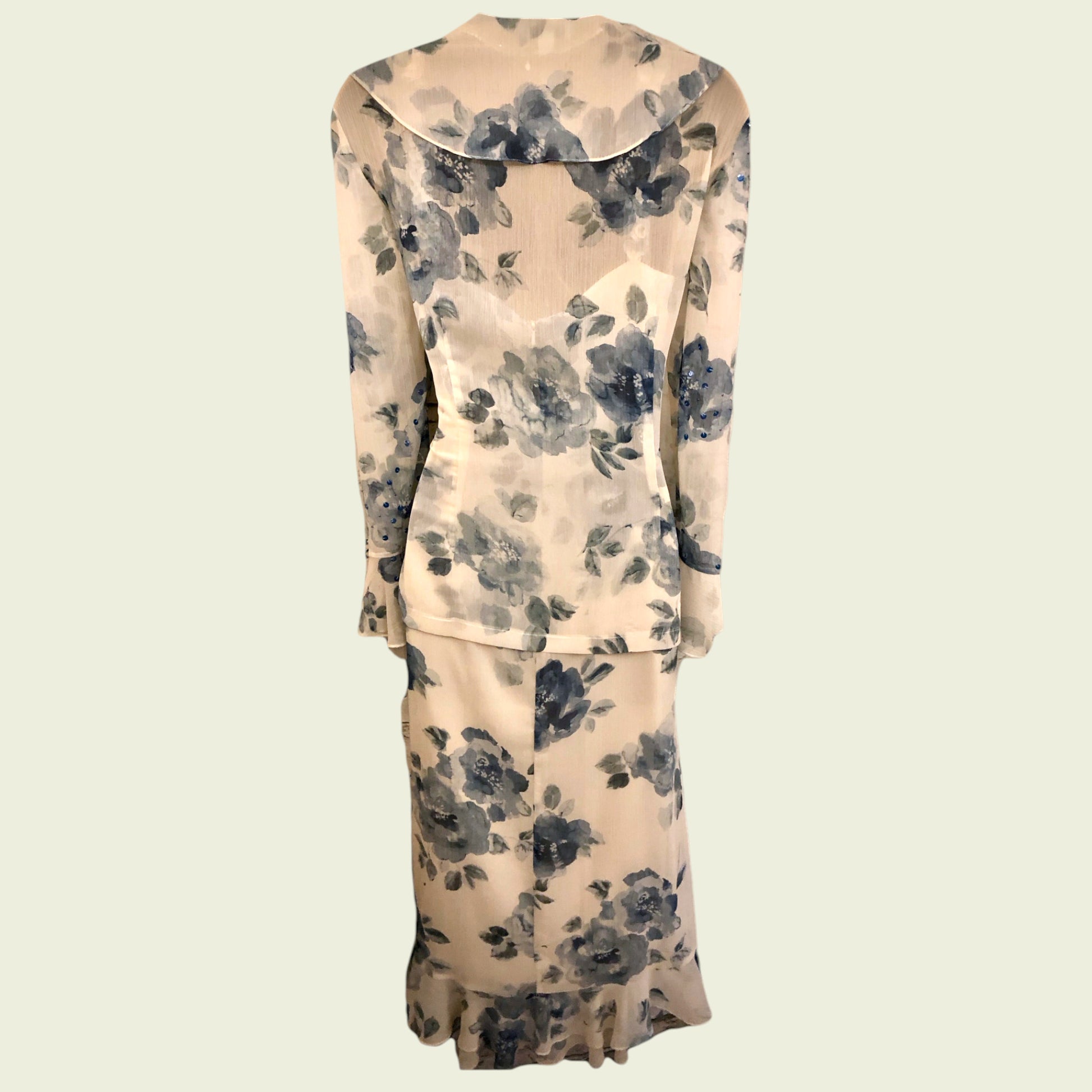 Floral-patterned two-piece suit on a beige background