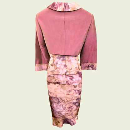 Outfit with a pink top and floral dress on a beige background