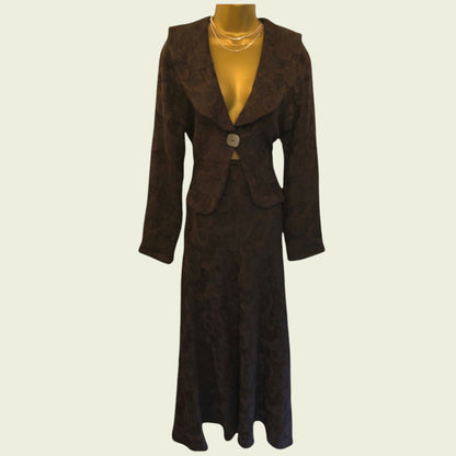 Brown patterned suit on a mannequin against a beige background