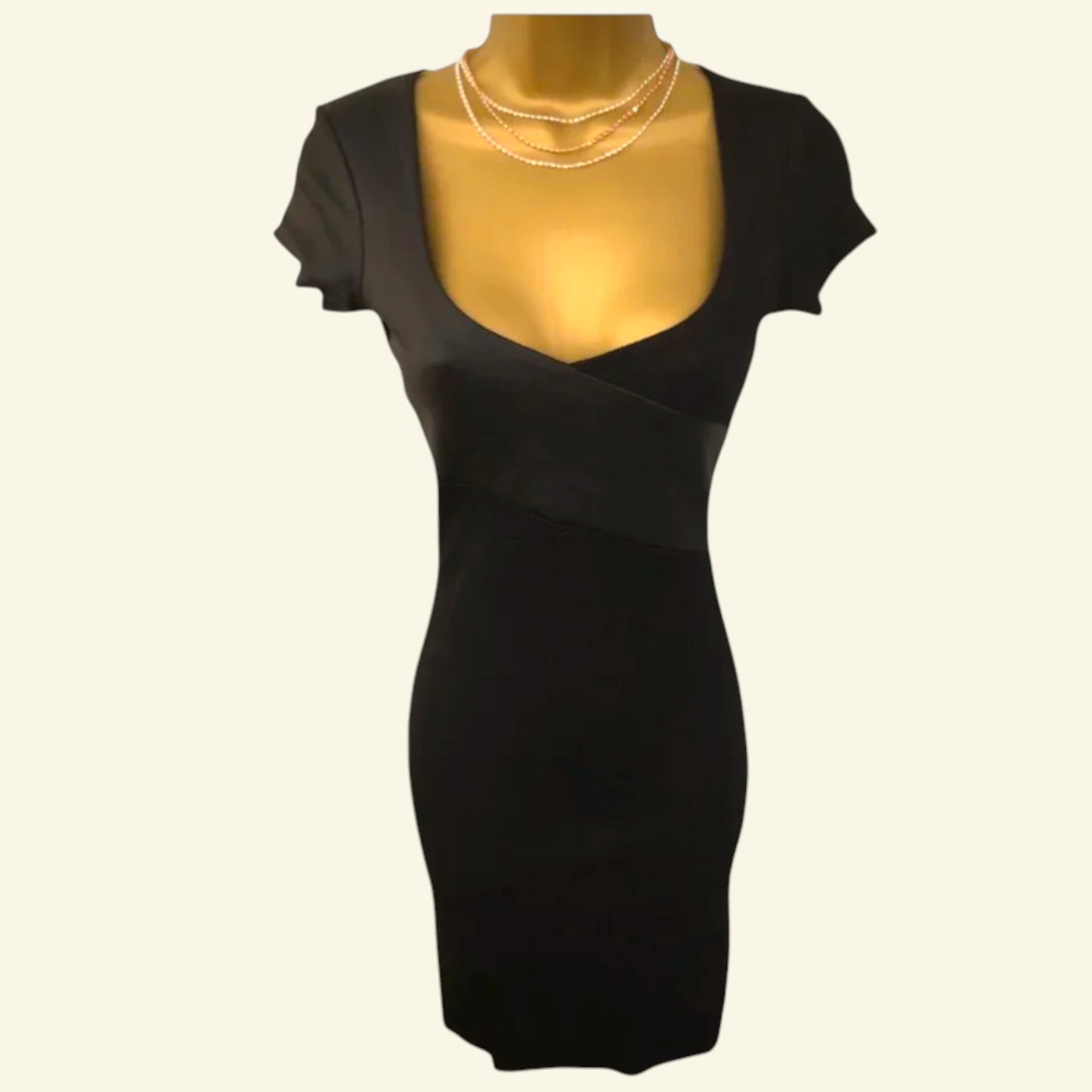 Black dress on a mannequin with a white background