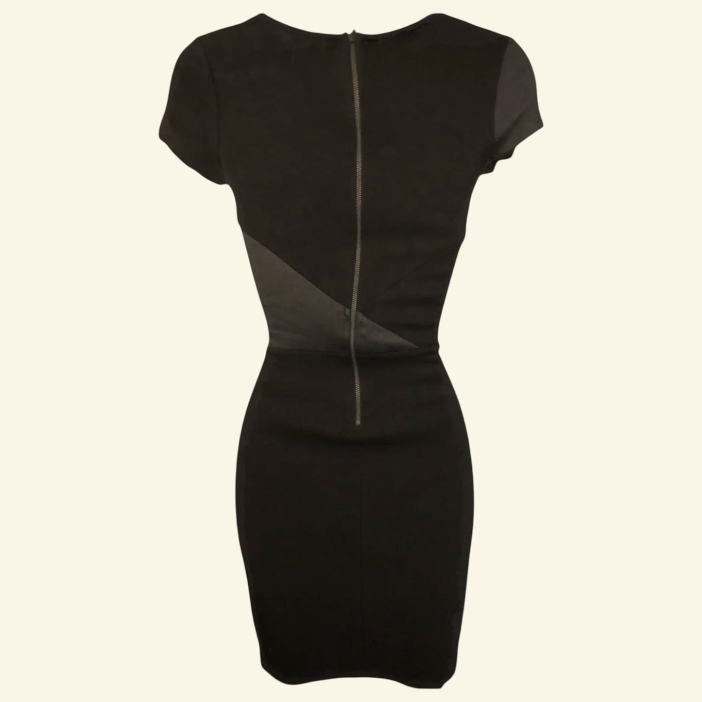 Black dress with a zipper detail on a white background