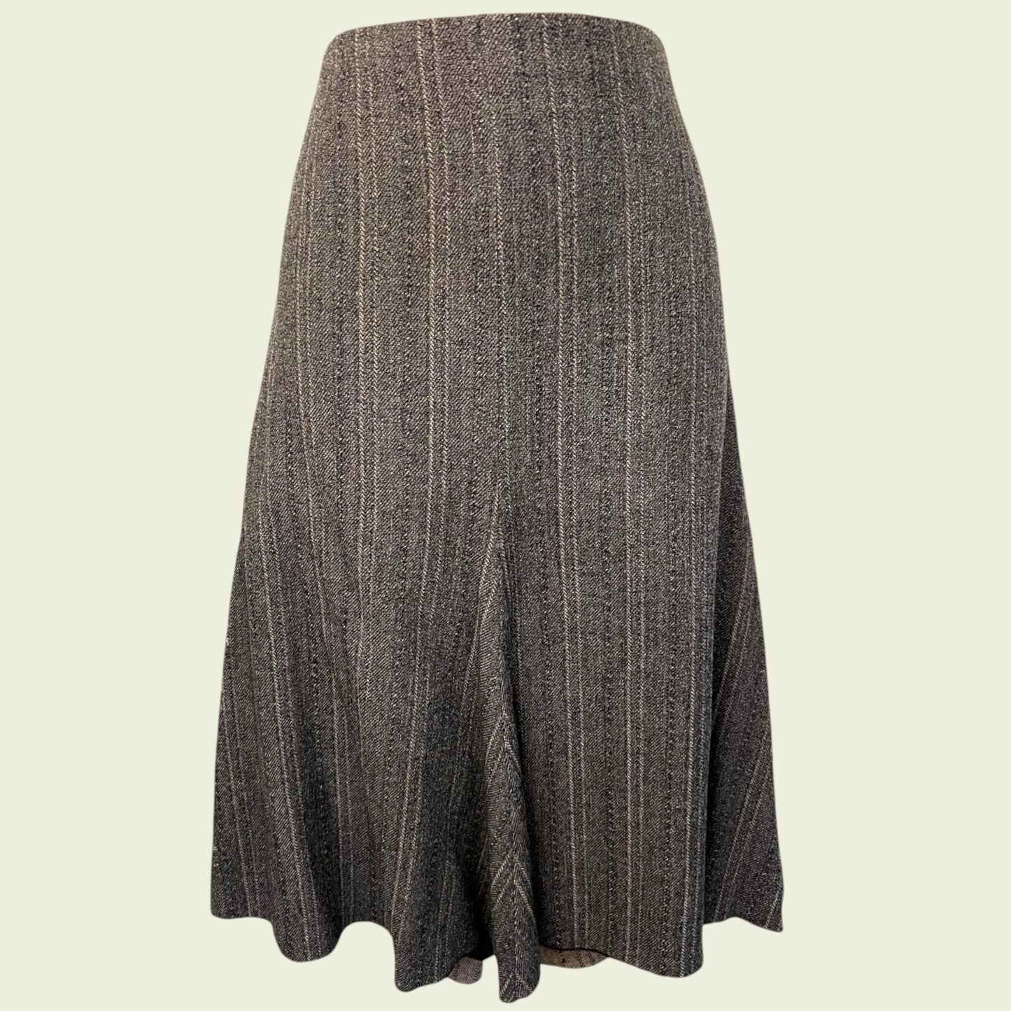 Textured grey skirt on beige background