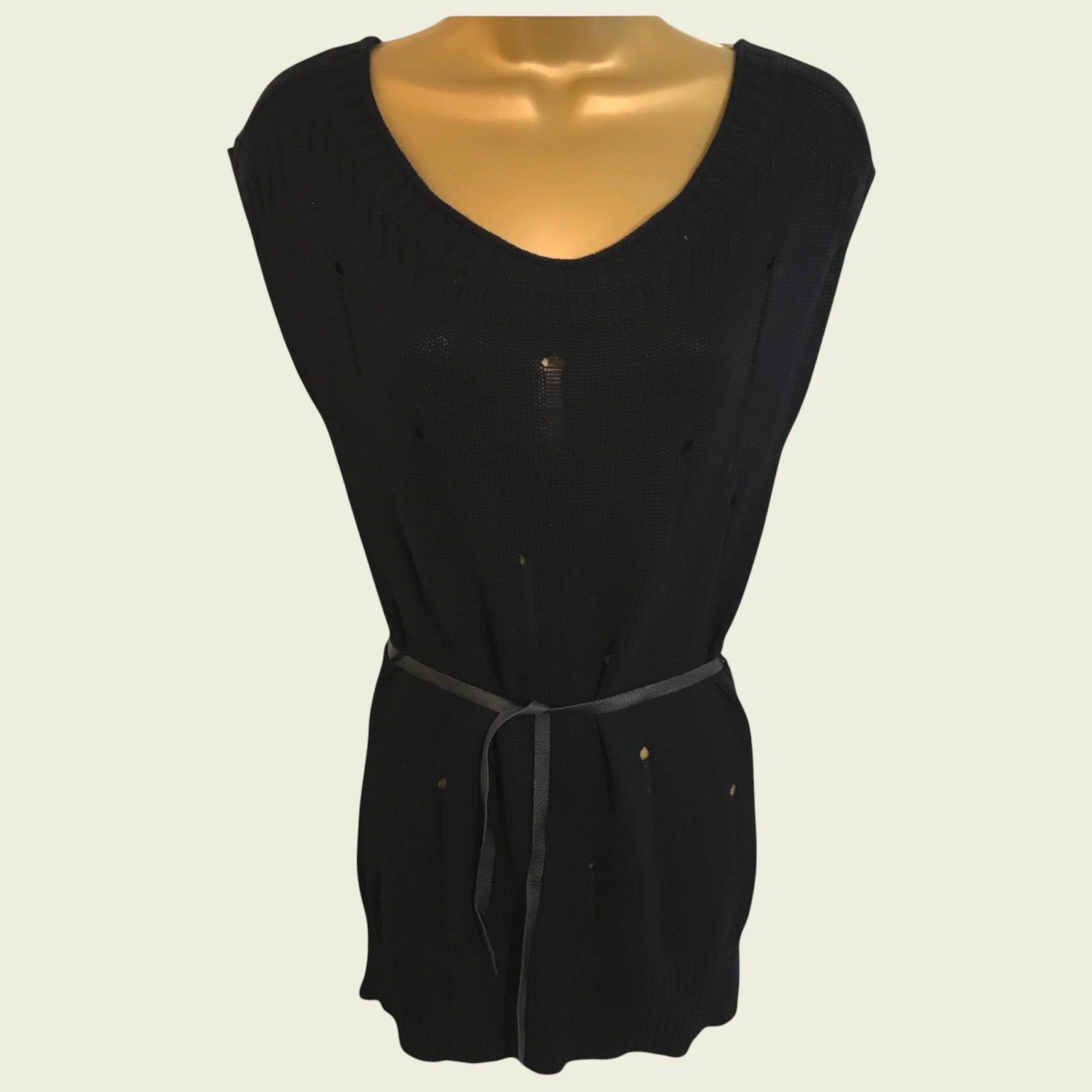 Black sleeveless top on a mannequin against a beige background