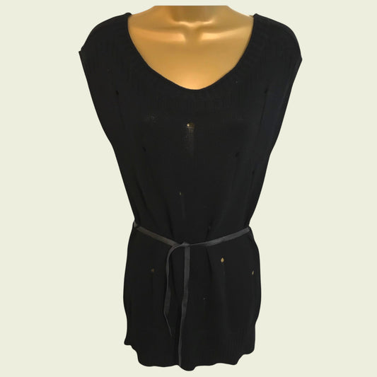 Black sleeveless top on a mannequin against a beige background