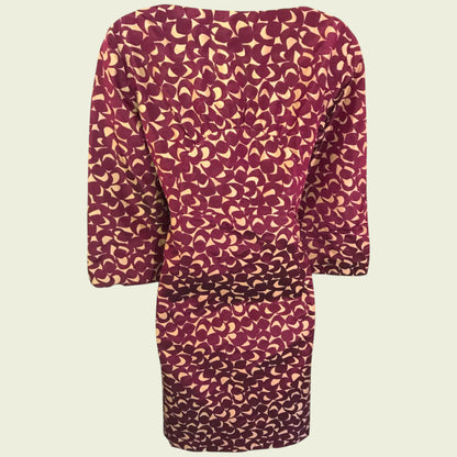 Purple dress with a pattern on a beige background