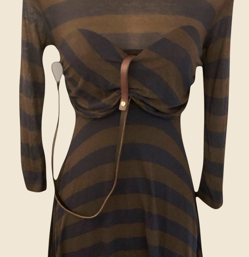 Brown and blue striped dress with a leather strap on a beige background