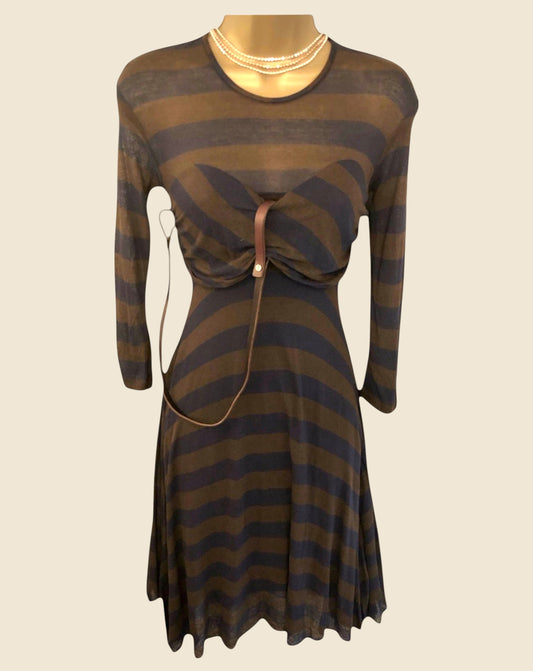 Striped dress with a belt on a mannequin against a beige background