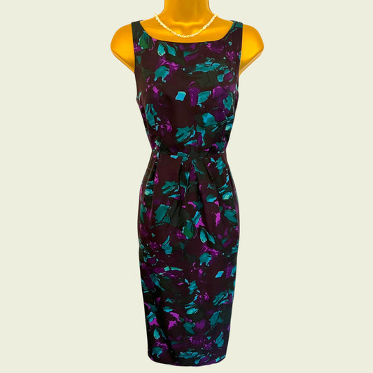 Mannequin wearing Black purple and turquoise pencil dress on a beige background