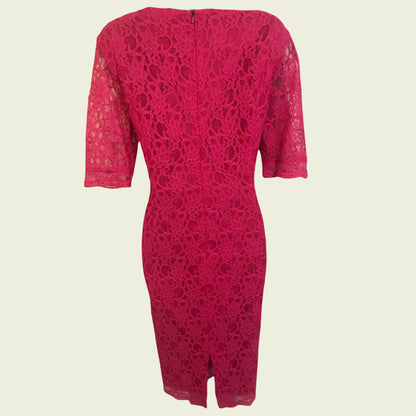 Pink lace dress on beige background