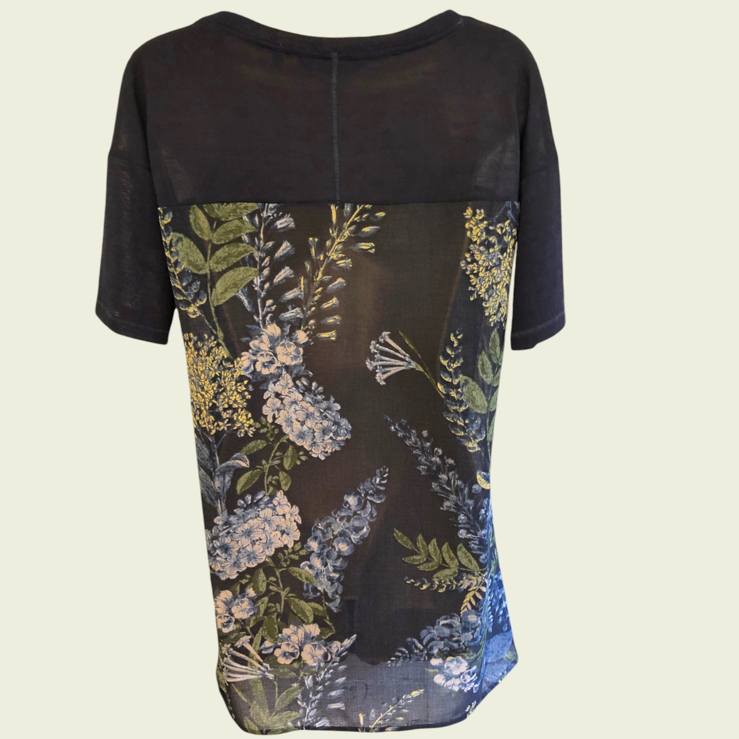 Navy dress with floral pattern on a beige background