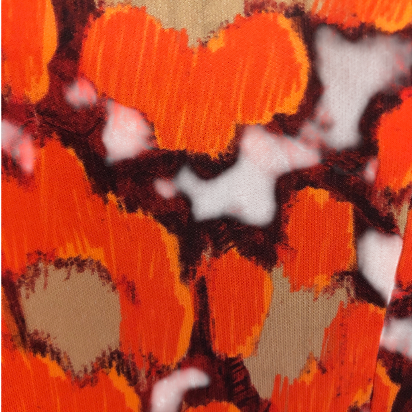 Swatch showing orange, black and beige colours