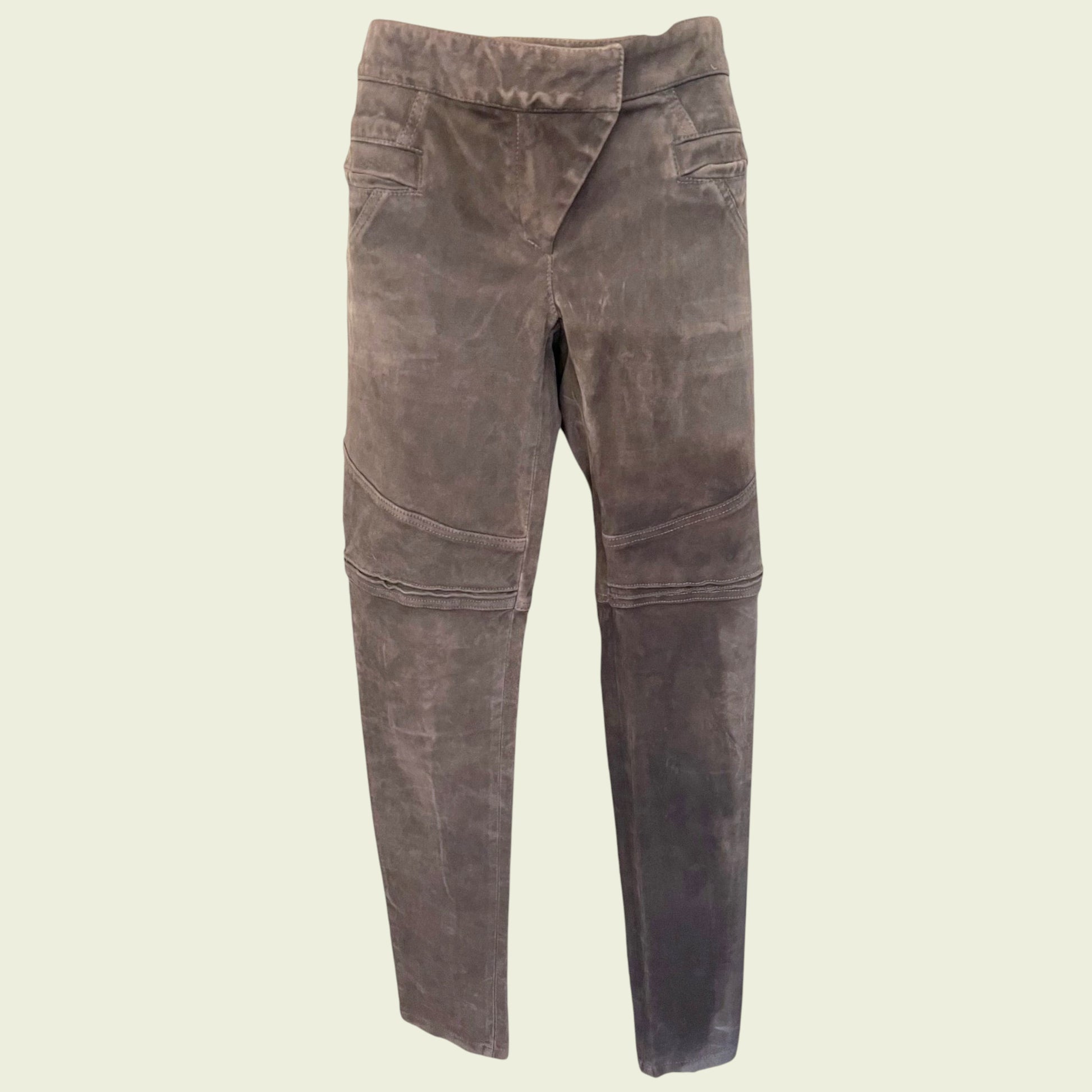 Grey suede pants on a beige background