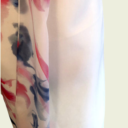 Chiffon overlay of pencil dress on white background