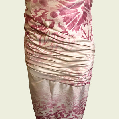 Close up of pink and cream dress on beige background