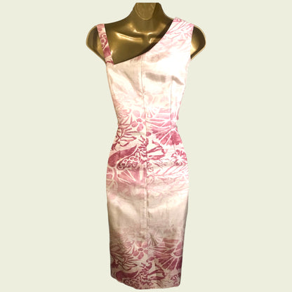 Mannequin with pink and cream floral dress on beige background