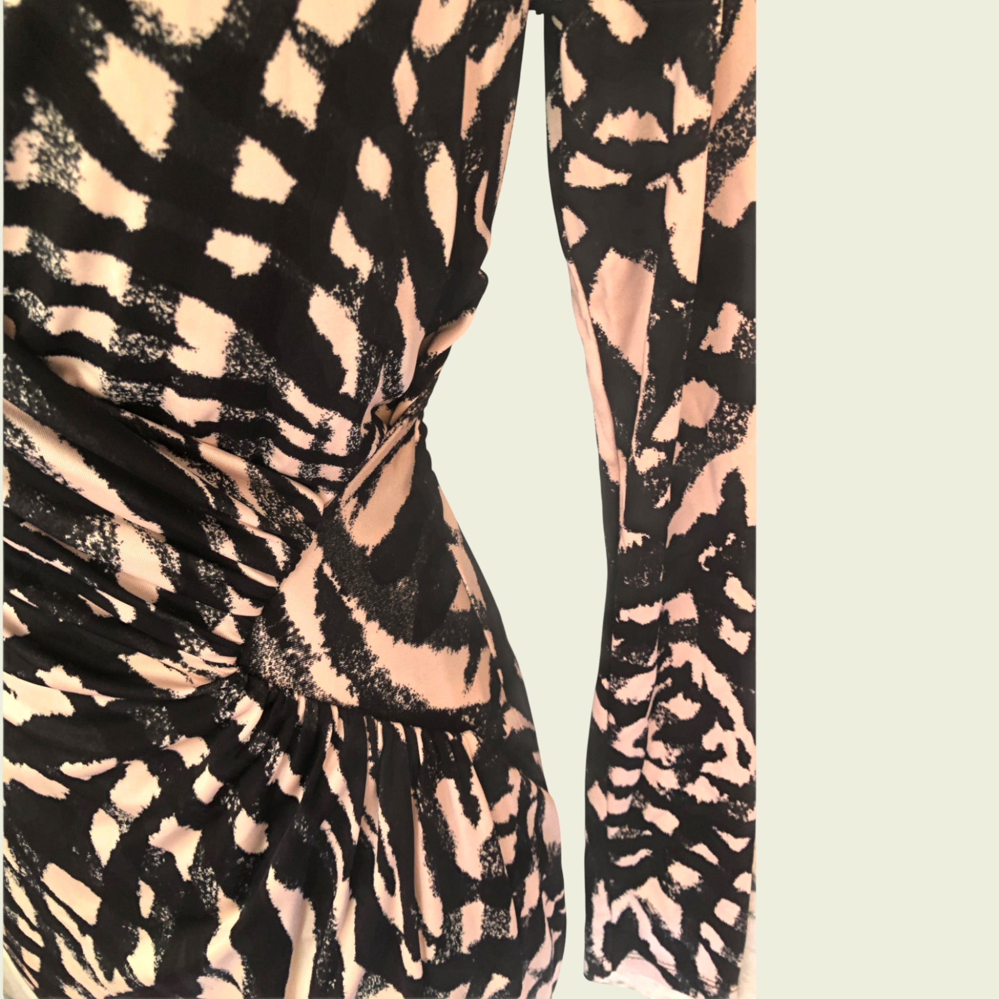 Patterned dress with black and beige design on a light background