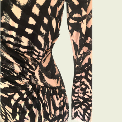 Patterned dress with black and beige design on a light background