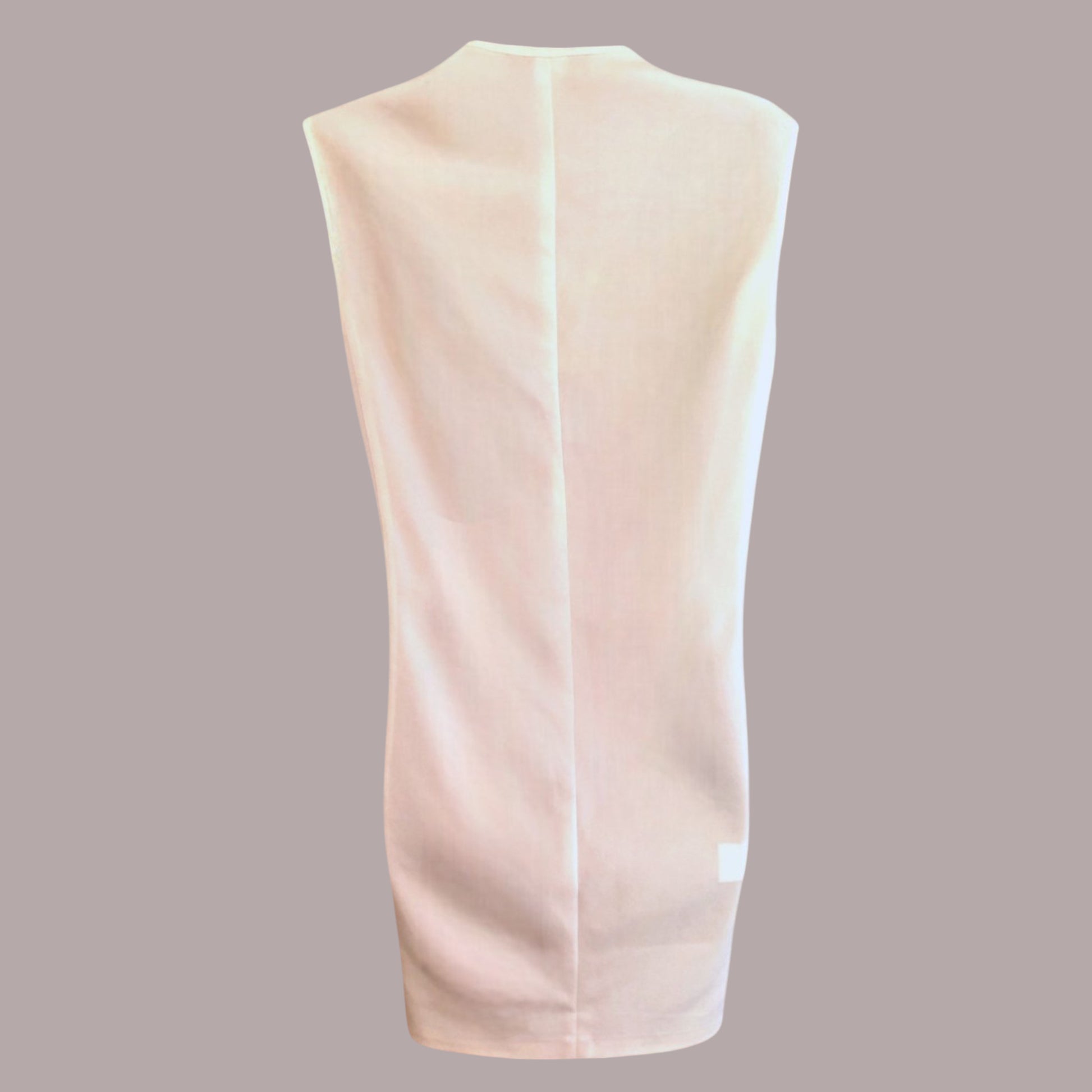 Back of cream mini dress on a beige background