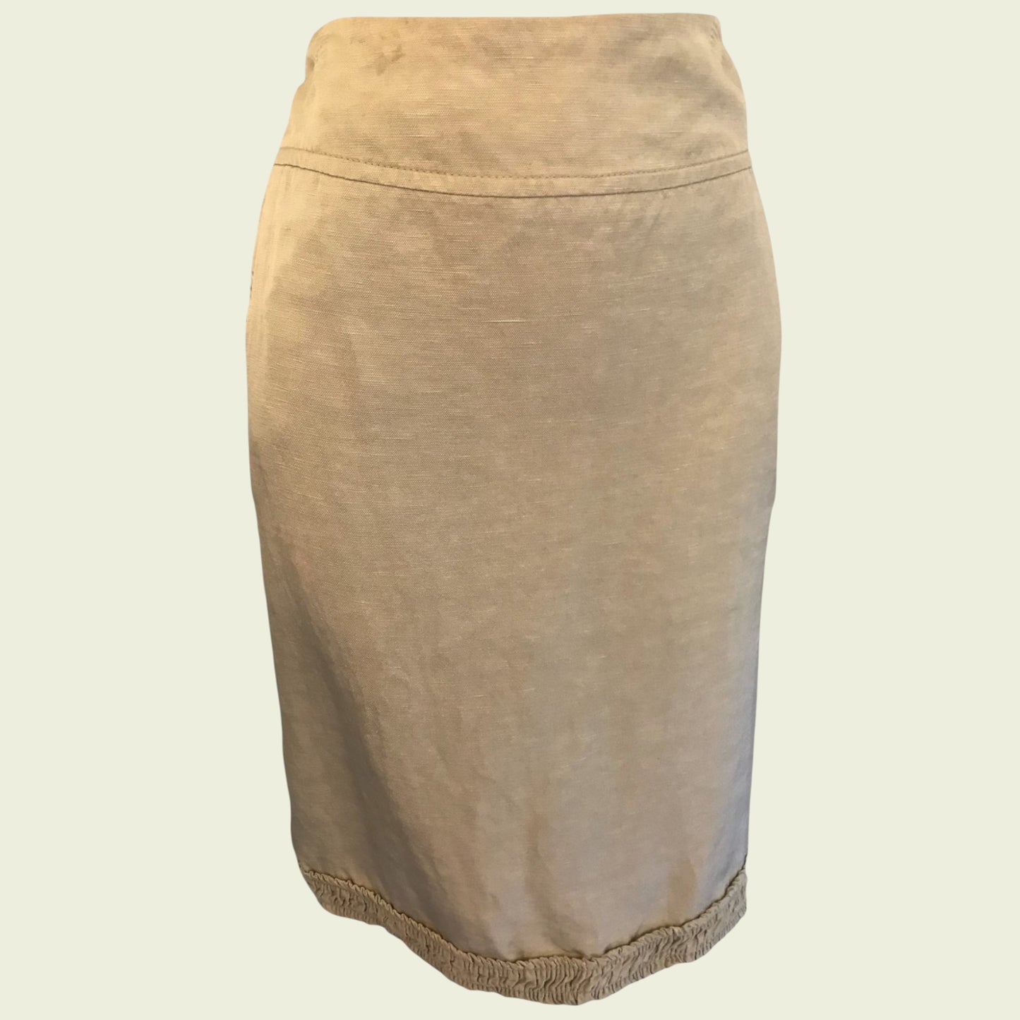 Tan skirt on beige background