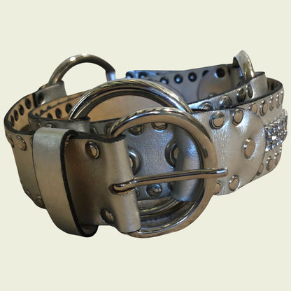 Silver studded belt on a beige background