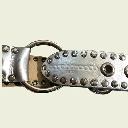 Silver studded belt on a beige background
