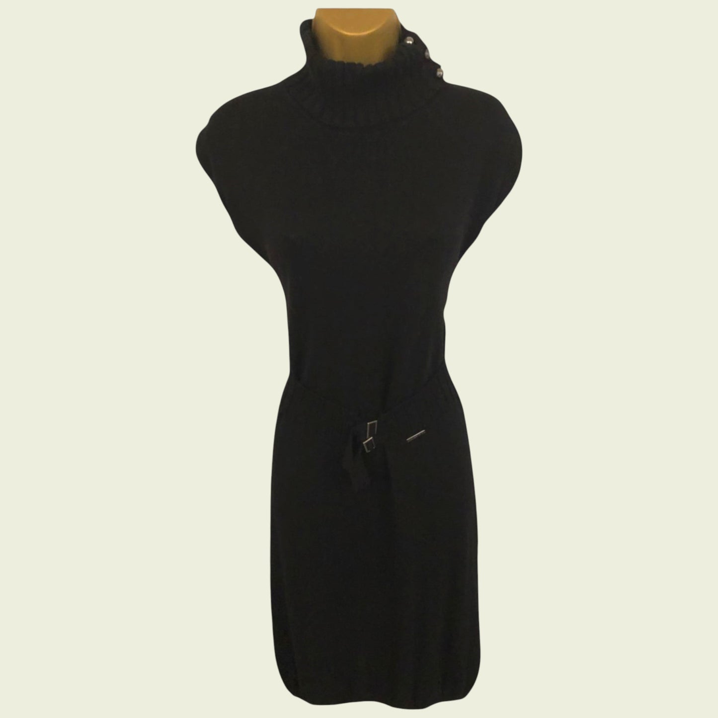 Black dress on a mannequin against a white background