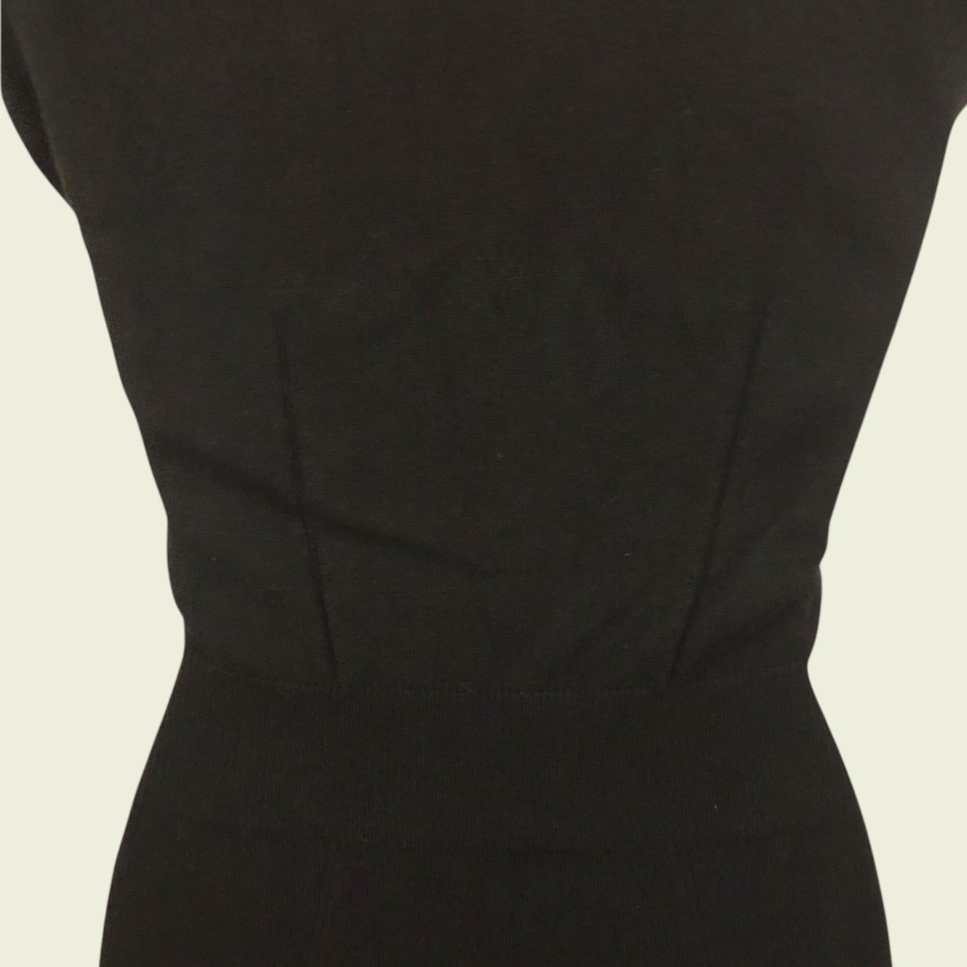 Black dress on a beige background