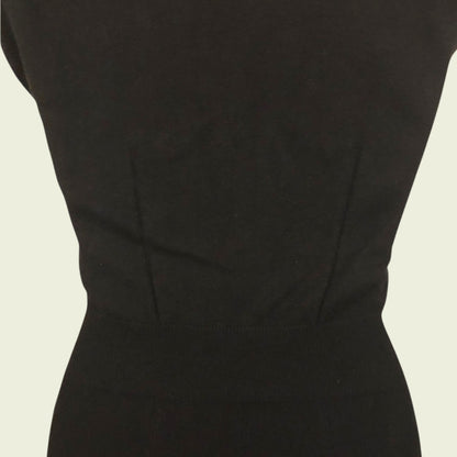 Black dress on a beige background